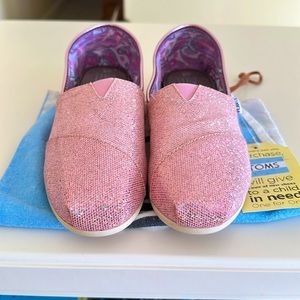 Tom’s pink glitter slip on shoes